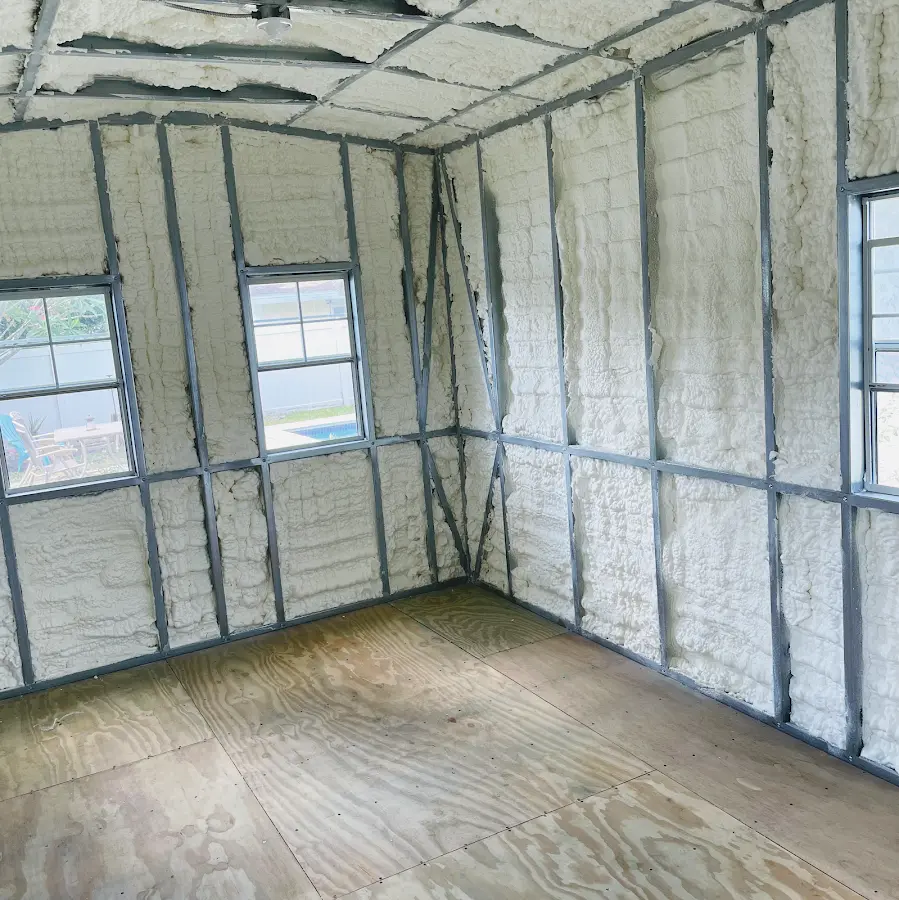 Closed-cell spray foam insulation applied to wall cavities in a residential project in Woodlake
